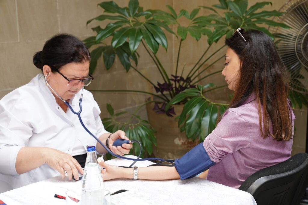 Medical professional checking a patient's blood pressure