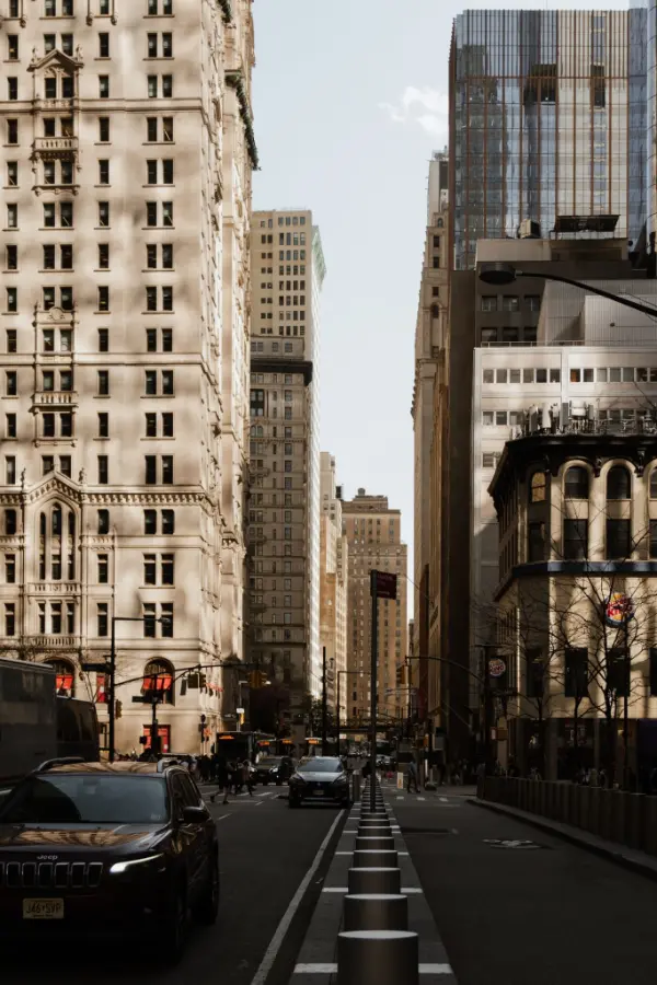 Narrow New York street between tall office buildings